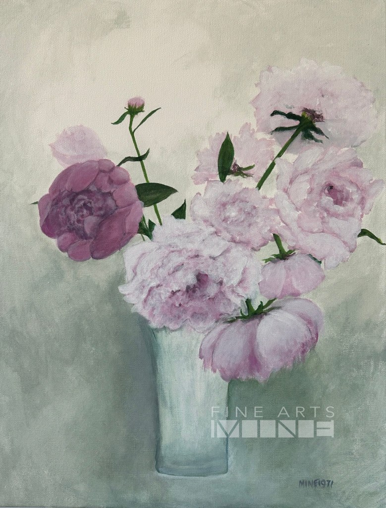 Still life of pink and purple flowers in a vase.